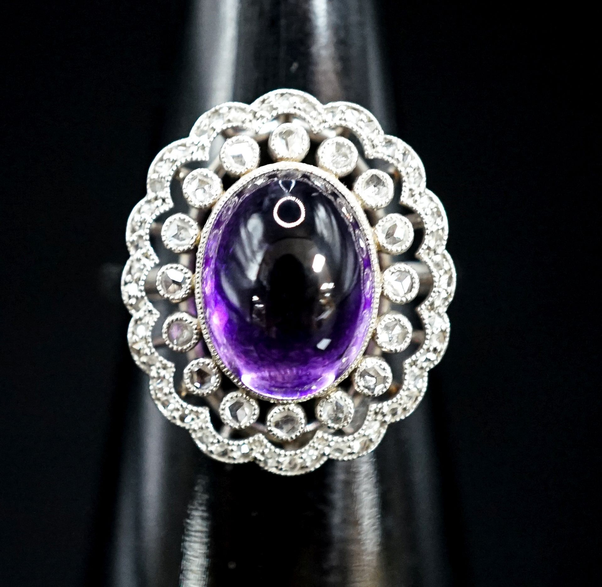 A 1920's white metal, cabochon amethyst and rose cut diamond ring, size M, gross weight 5.9 grams.